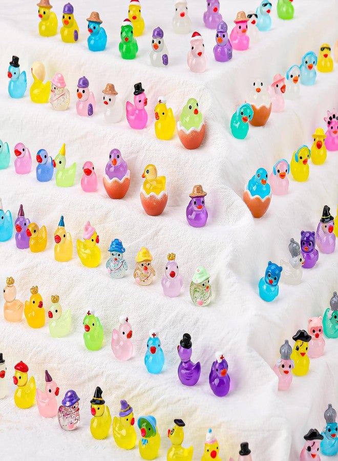 GGSTDDUP 100 Pcs Luminous Mini Resin Ducks, Tiny Ducks Figurines to Hide Wearing Hats Glow in Dark for DIY Fairy Garden Dollhouse Cake Decoration (27 Styles) - Image 1